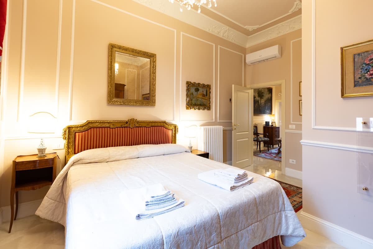 Detail of the gilded headboard in the main bedroom