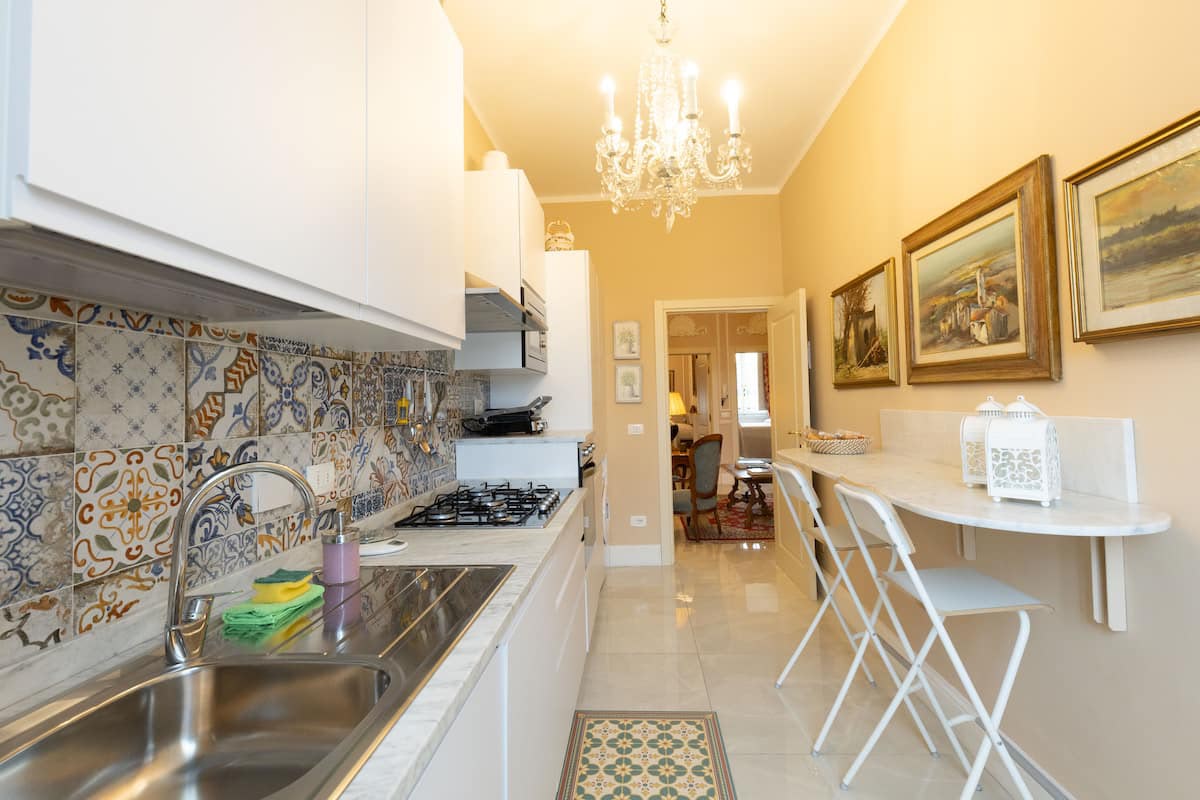 Fully equipped kitchen with chandelier